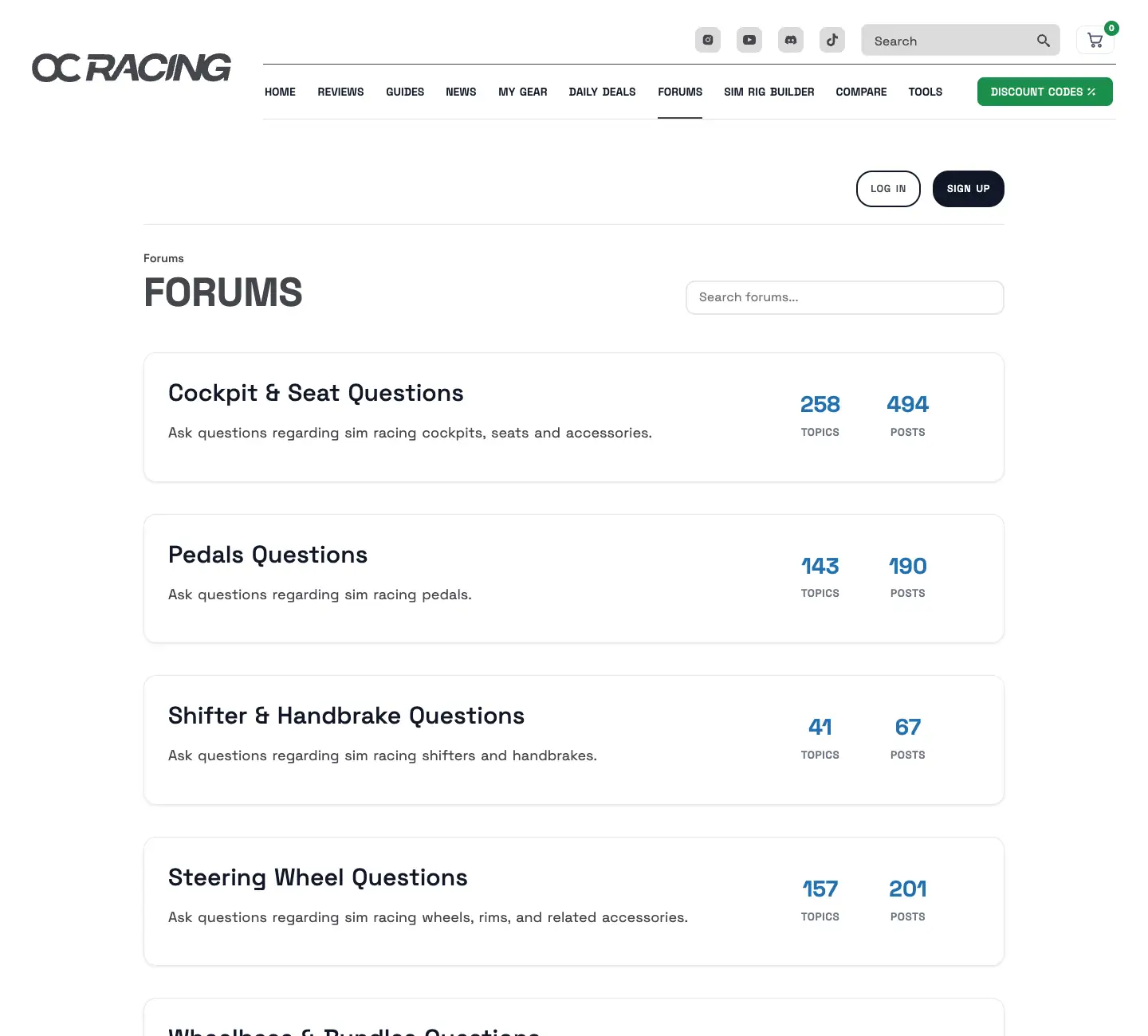 The forum index with boards such as cockpits, pedals, wheels and general questions, with counts of threads and posts.